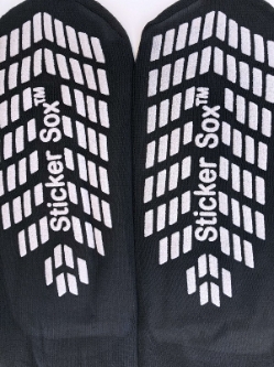 Close up of white rubber treads on Black Bari Tred Non Slip Socks