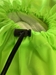 Closeup of Slip lock Toggle Closure on the Drawstring of the Fluorescent Green Polyester Laundry Bag