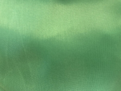 Close up of green polyester fabric on the 30x40 Green Laundry Bag with Carry Strap