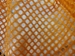 Close up of orange mesh laundry bag