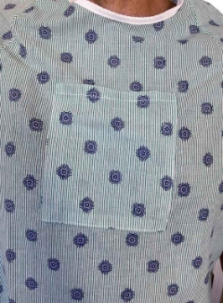 Closeup of Shoulder Snap Gown with Green Stripes and Blue Geometric Pattern