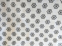 Closeup of White Economy Hospital Gown Unisex with Snowflake Pattern